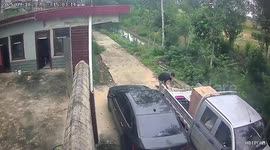 Bungling motorcycle rider tries to ride up plank but falls into ditch
