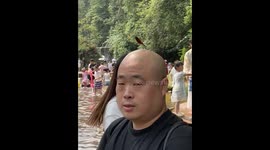 Dragonfly lands on bald man’s head in Sichuan, China