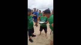 Staff search for candy in bowls of flour for team building exercises