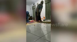 Cute little girl takes tumble as she bows down to pray with parents