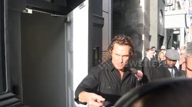 Matthew McConaughey signs for eager fans when he leaves the London Palladium having read poems from his new book