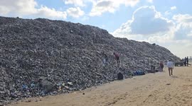 Palestinians displaced from Gaza City set up tents near garbage piles in Deir al-Balah