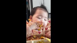 Sleepy baby dozes off while eating in Seoul, South Korea