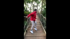 Tourist drops phone on rope bridge