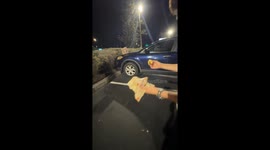 Man shares taco with raccoon outside Taco Bell in Lithia, Florida, USA
