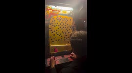 Man wins tricky arcade game Ice Cold Beer in Los Angeles, California, USA