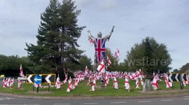 Massive Union Jack draped over roundabout statue as flag wars rage on