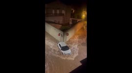 Vehicles submerged by powerful street flooding in Tarragona, Spain