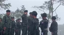 Thai soldiers salute flag and sing anthem along disputed border with Cambodia