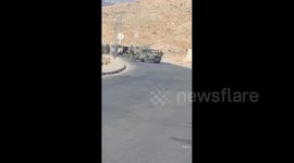 Israeli forces close the entrance to the village of Al-Mughayir, northeast of Ramallah in the West Bank