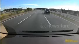 Quick-thinking driver swerves to avoid boxes hurtling towards car