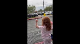 Performers balance atop two horses at Walmart in Las Vegas, USA