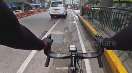 Cyclist knocked over by taxi passenger opening door