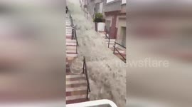 Valencia floods cascade down stairs as rain hits region