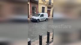 Floods engulf streets during heavy rain in Algemesi, Spain