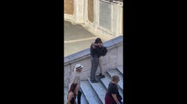 Couple kiss on famous steps in Italy