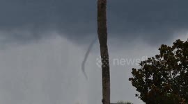 Tornado appears above homes amid storms in Florida