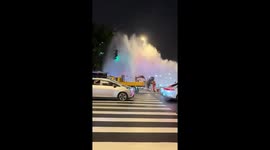 Excavator bursts water pipe sending giant fountain skyward on busy road