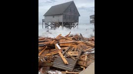 Unoccupied homes in North Carolina collapse amid rough seas from hurricanes Humberto and Imelda