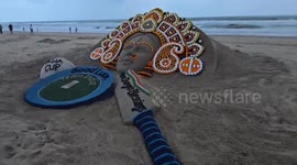Sand artist makes beach sculpture wishing Indian cricket team good luck