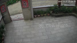 Woman crashes scooter into gate in Anhui, China