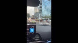 Happy scooter riders waiting at traffic light in Shandong, China