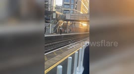 Video shows youths retrieving phone from track - then running off with it