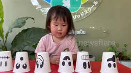 Impressive moment toddler shows off memory skills by solving cup puzzle