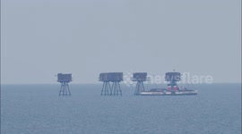 Waverley paddle steamer sails around Red Sands Forts off Kent, UK