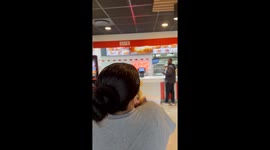 Fastfood staff delighted by baby in fuzzy yellow costume in Durban, South Africa