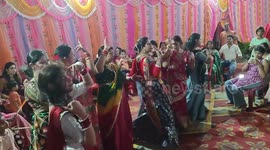 Indian women perform sacred dance at Hindu festival
