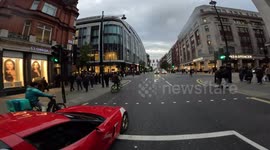 Driver speeds down Oxford Street and almost skids out of lane before confronted by cyclist