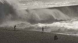 Photographers on the beach at Newhaven Sussex UK capturing the action created by Storm Amy on 4th October 2025