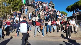 Protesters climb Saint Francis statue near St. John’s Basilica in Rome during Gaza solidarity rally