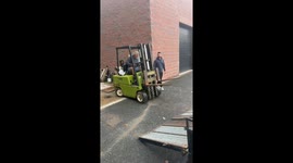 Driving Forklift Up a Trailer Ramp