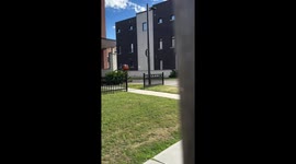 Dachshund walks with owner in matching mascot costume in Oshawa, Canada