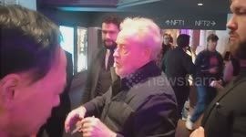 Sir Ridley Scott signs for fans when arriving at the national Film Theatre