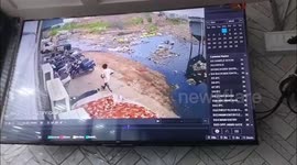 Sudden surge of water at dumping site in India crashes into vehicles