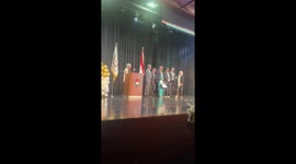 Little girl amuses crowd at graduation ceremony in Beirut, Lebanon