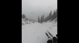 Skillful ski down misty mountain slopes in Alta, Utah, USA