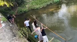 Bamboo raft sinks as man jumps on while friends onboard
