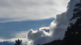 Spectacular shining UFO clouds form above homes
