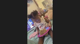 Toddler Uses Tablet as a Waffle Holder
