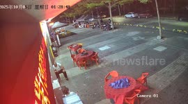 Typhoon blows away tables from outside restaurant in China