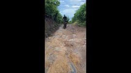 Mountain biker continues downhill with bent front wheel in Guatemala