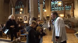 Akita blessing at Holy Trinity Sloane Square during St Francis celebrations by Christians in London