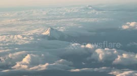 Aerial sunset view of snow-capped Mount Hood from flight in Portland, Oregon, USA
