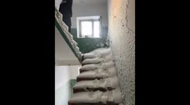 Man slips on snowy stairs in Vorkuta, Russia