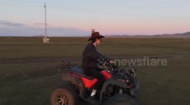 Quad bike tilts and rider falls in Inner Mongolia, China