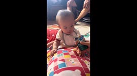 Food splatters on baby’s face during feeding in Guangdong, China